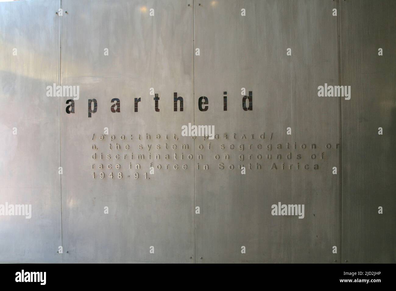 Definition of apartheid on wall in the exhibit at the Apartheid Museum, Johannesburg, Gauteng, South Africa. Stock Photo