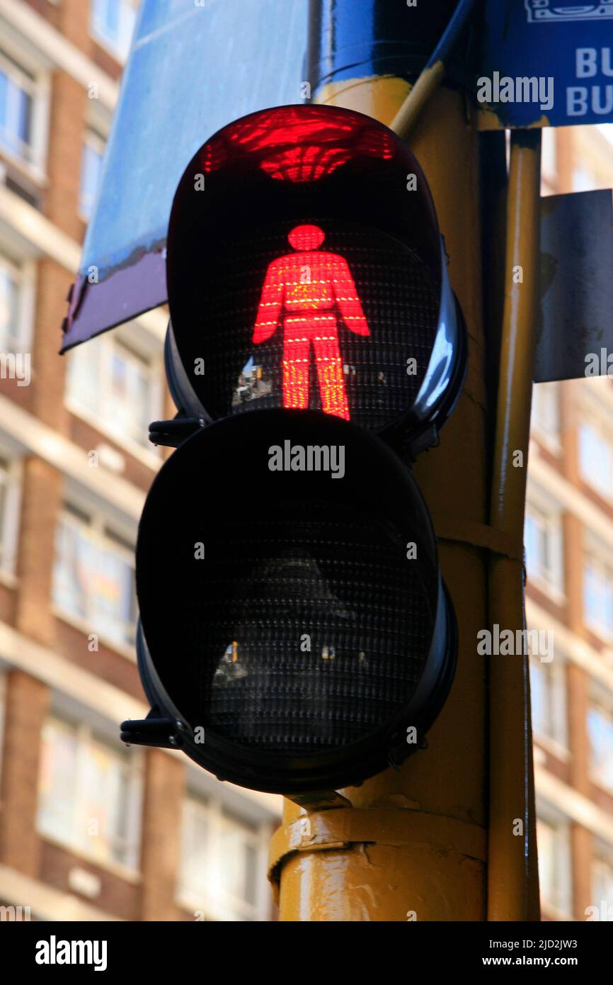 Pedestrian traffic light on red stop light at pedestrian crossing