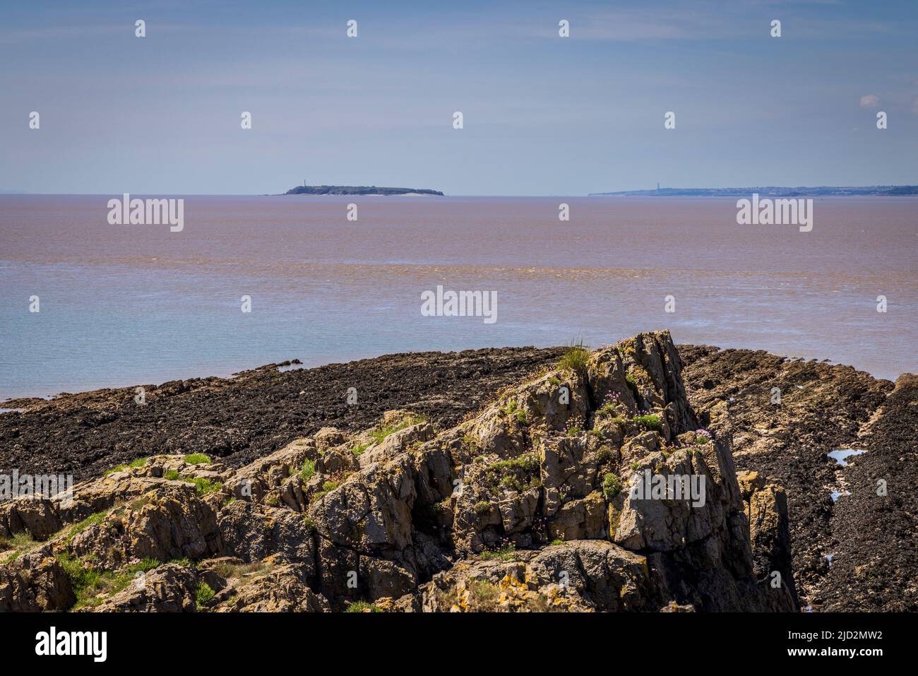 The west tip of Sand Point in the Bristol Channel with Flat Holme and the Welsh Coast in the background, Somerset, England Stock Photo
