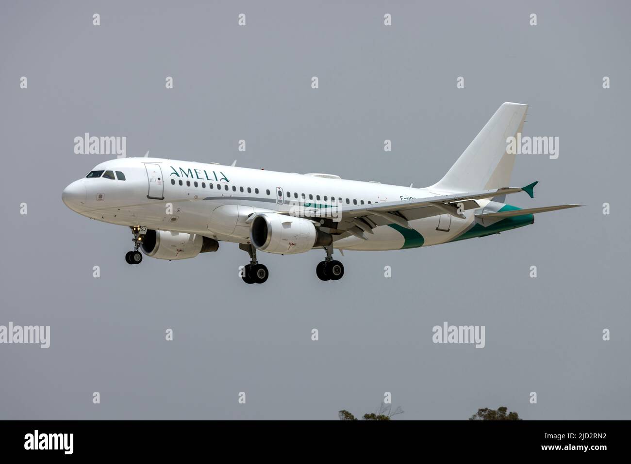 Amelia International Airbus A319-112 (REG: F-HDSJ) arriving in an already hot midday for the beginning of May. Stock Photo