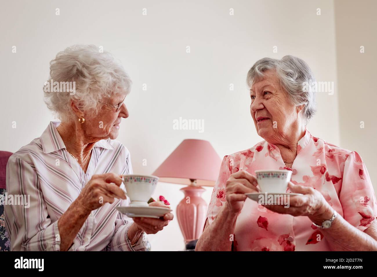 Afternoon tea is the perfect time for a catch up. Shot of two happy