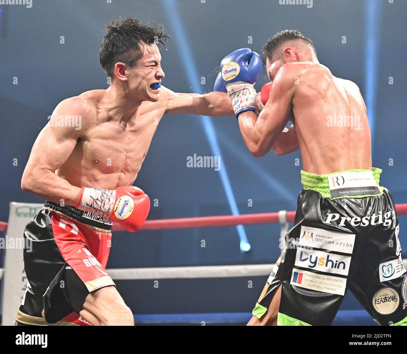 Masanori Rikiishi (red gloves) and Takuya Watanabe (blue gloves ...