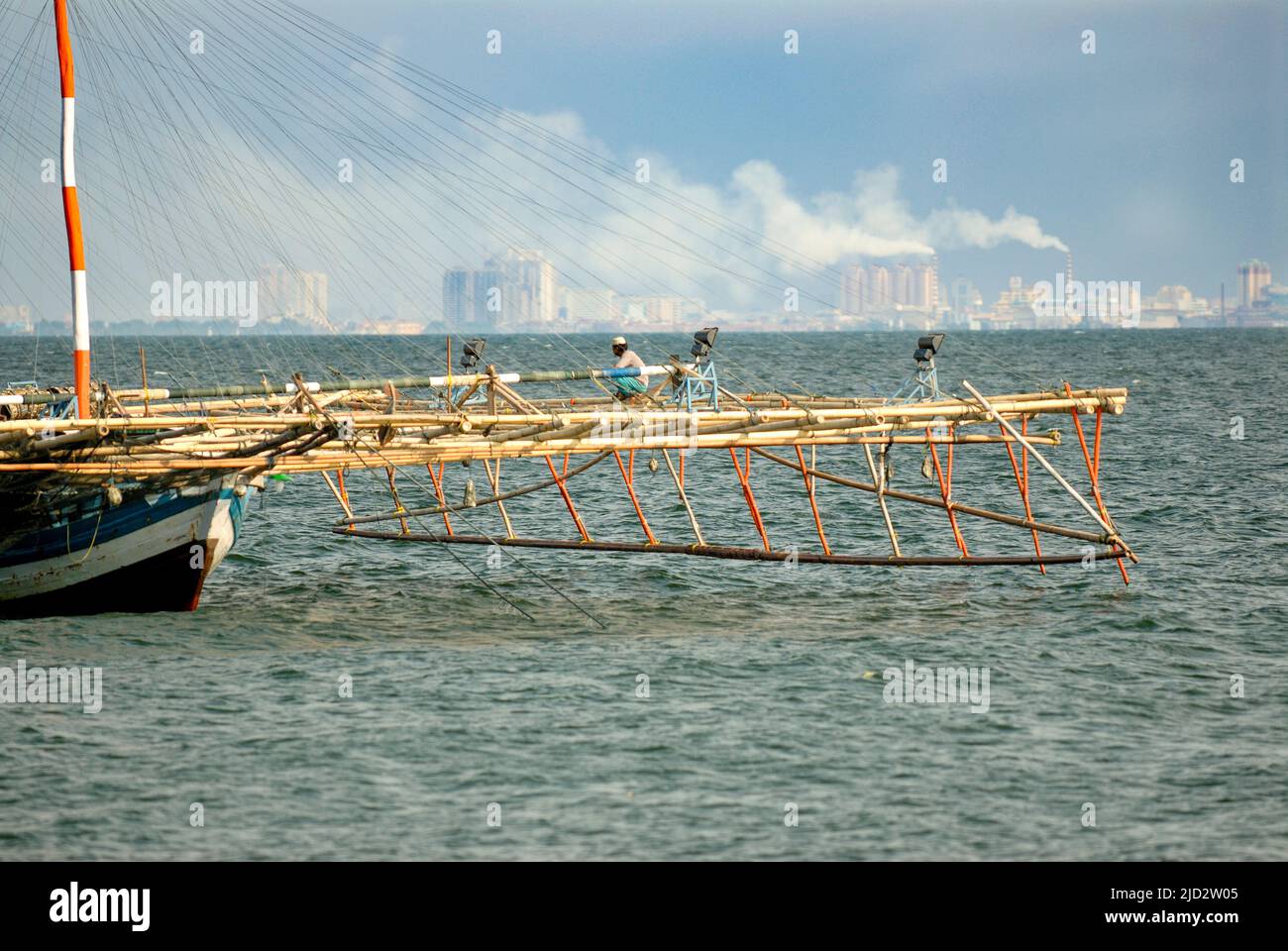One of the traditional fishing boats belonging to fishermen living in Pulau Seribu (Thousand Islands), looking toward Jakarta. Stock Photo
