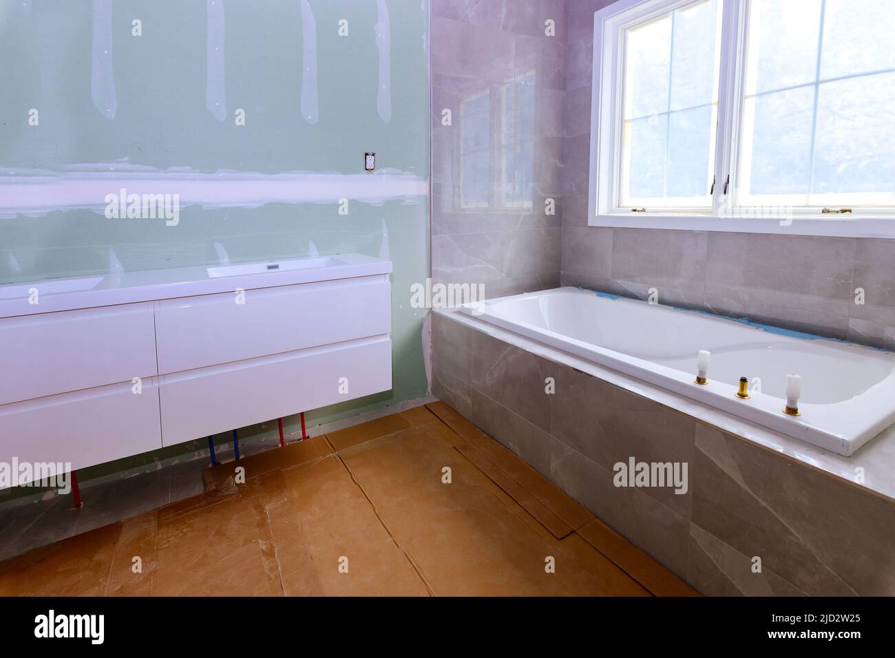 Remodeling bathroom with drywall repair, plastering painting Stock Photo Alamy