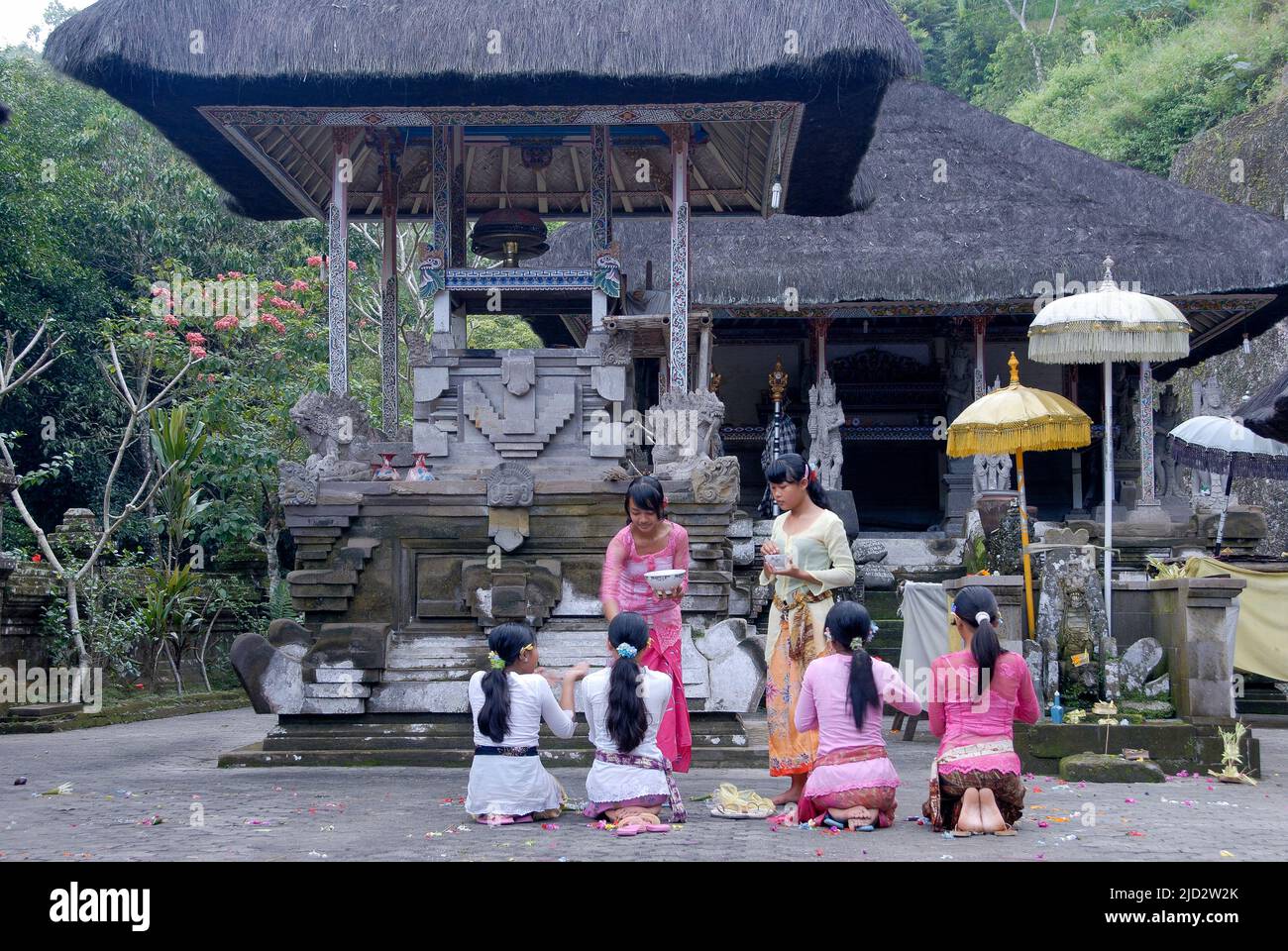 Devotees at the temple at Tirta Empul, holy springs discovered in 962. Stock Photo