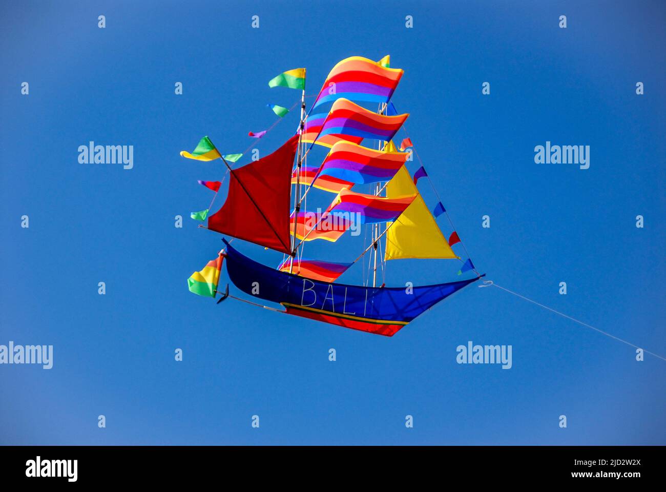 A kite promoting the 'Island of the Gods' on Nusa Dua beach. Stock Photo