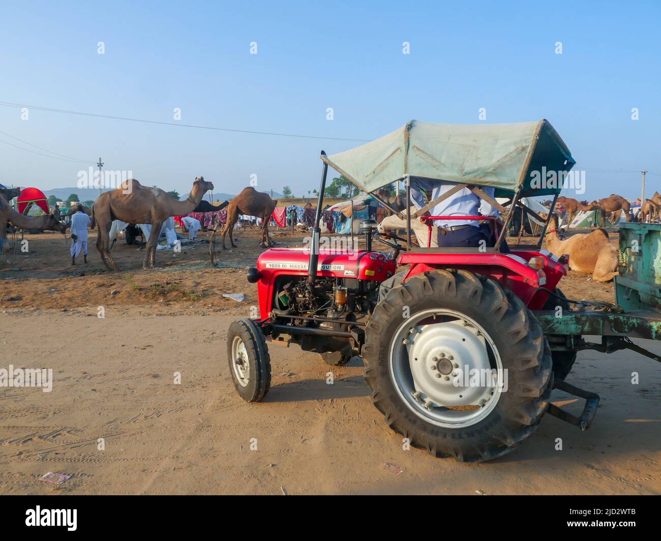 Pushkar, Rajasthan India - November 04, 2019 : Tractor running on road in Indian countryside areas. Tractor is mode of transportation in villages Stock Photo