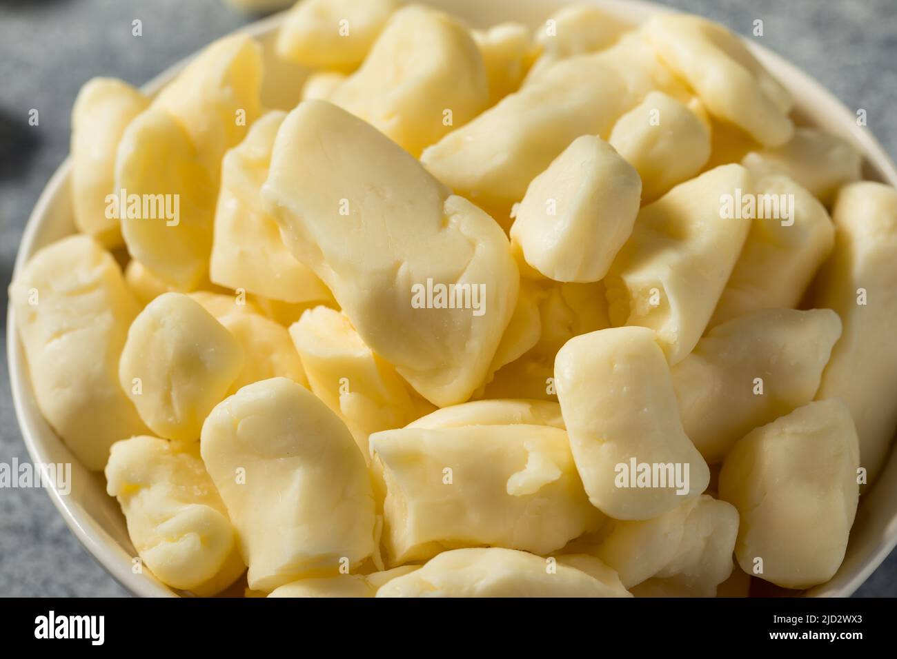 Raw White Organic Cheese Curds in a Bowl Stock Photo Alamy