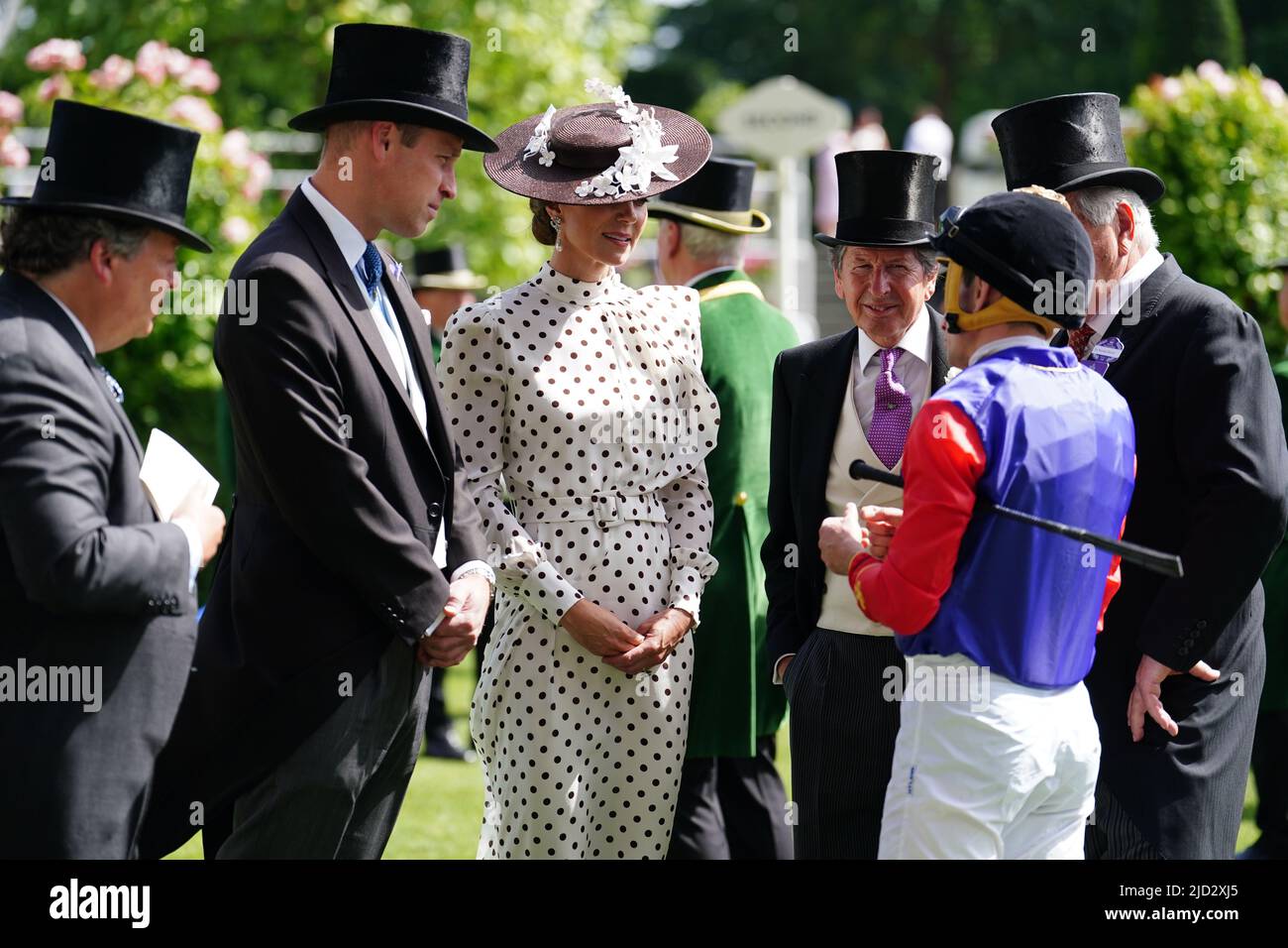 The Duke of Cambridge and The Duchess of Cambridge speak to jockey Ryan Moore who is to ride horse Just Fine in the Duke of Edinburgh Stakes during day four of Royal Ascot at Ascot Racecourse. Picture date: Friday June 17, 2022. Stock Photo
