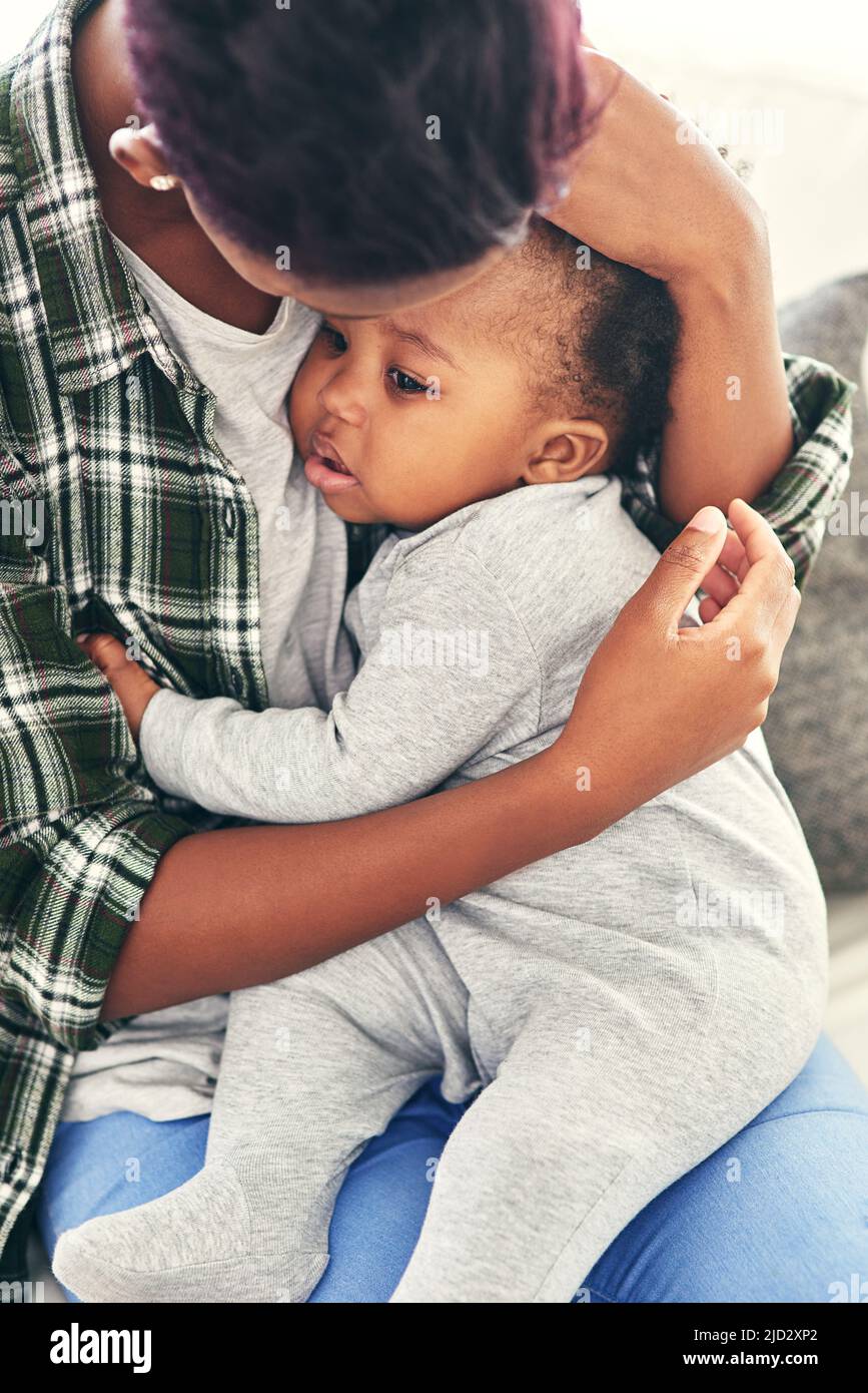 Hush my little angle. Shot of a mother cradling her little baby boy. Stock Photo