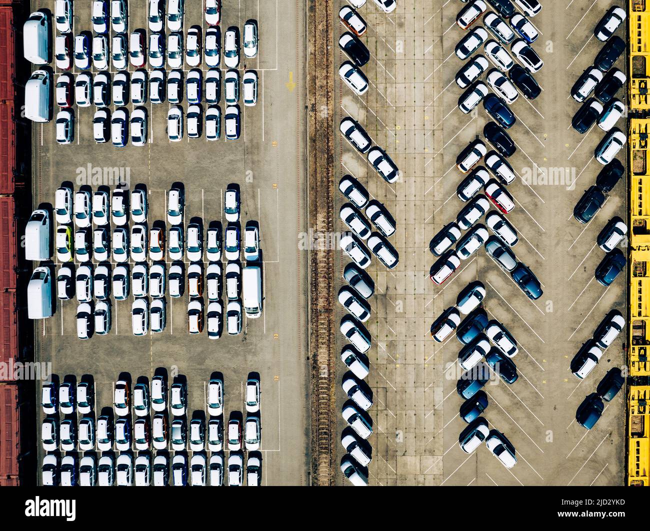 Aerial view new car lined up in the port for import and export business logistic to dealership for sale, Automobile and automotive car parking lot for Stock Photo