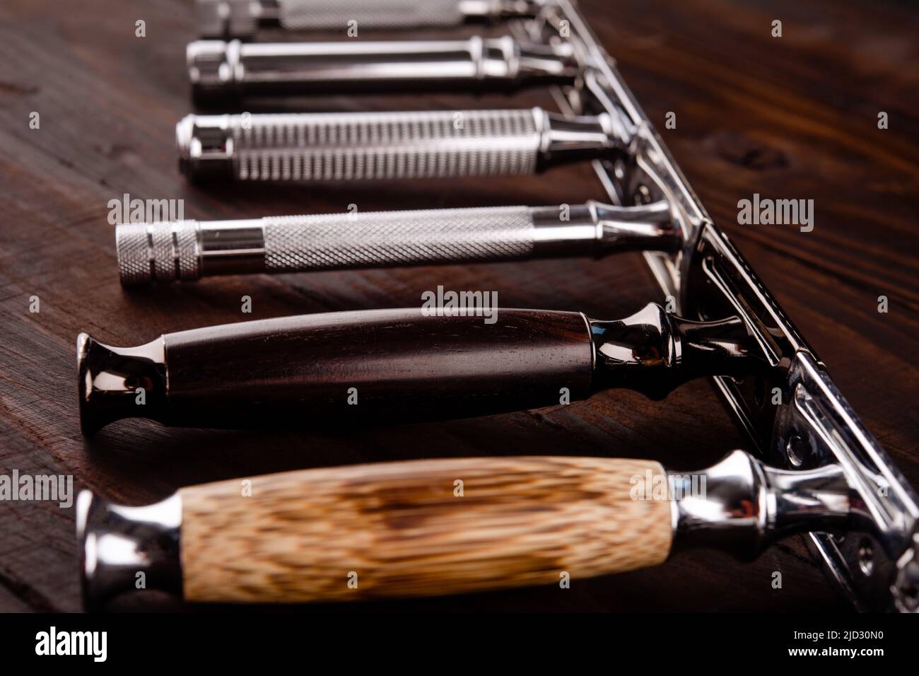 Different old vintage razors and brush on a black background. View from ...