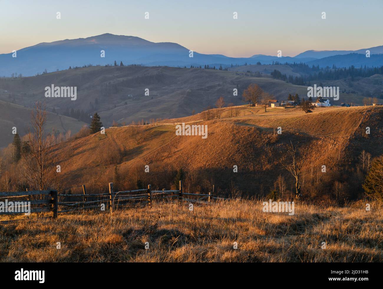 Late autumn mountain countyside sunset scene. Picturesque traveling, seasonal, nature and countryside beauty concept scene. Carpathians, Ukraine. Stock Photo