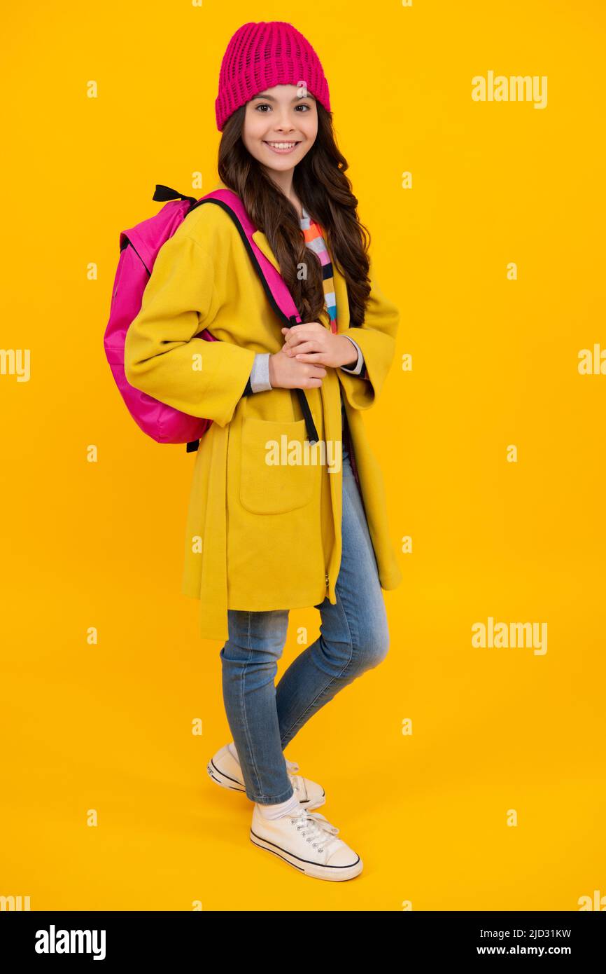 Autumn school. Teenager schoolgirl in school uniform with bagpack ...