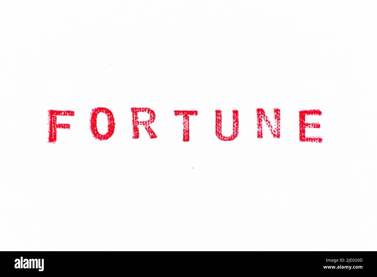 Red color rubber stamp in word fortune on white paper background Stock Photo