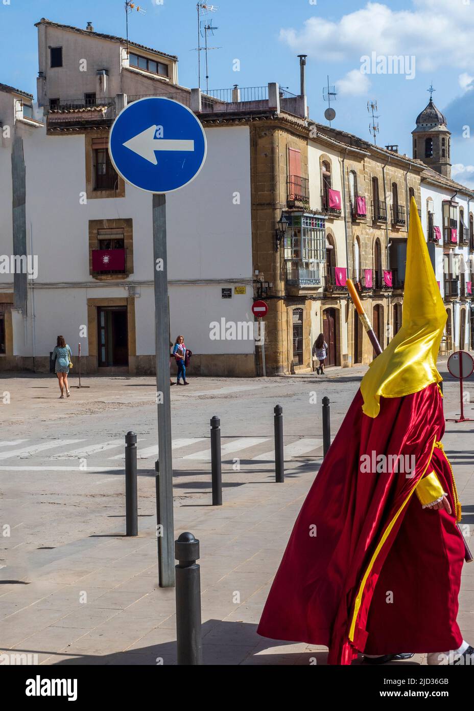 Nazarenes and penitents walking through the streets of Ubeda during the celebration of the traditional Holy Week. Stock Photo