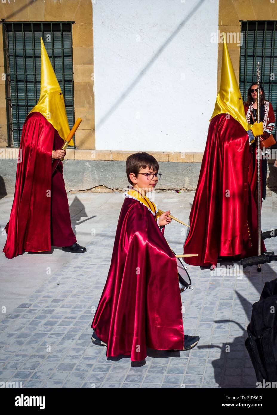 Nazarenes and brotherhoods parading through the streets of Ubeda during the celebration of the traditional Holy Week. Stock Photo