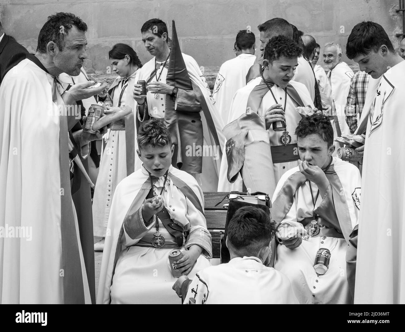 Group of people eating at the end of the parade through the streets of Ubeda in its traditional Holy Week. Stock Photo