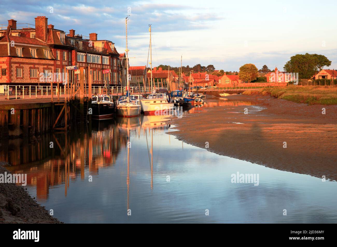 A view of the Blakeney Hotel by the harbour and quayside at low water on the North Norfolk coast at Blakeney, Norfolk, England, United Kingdom. Stock Photo