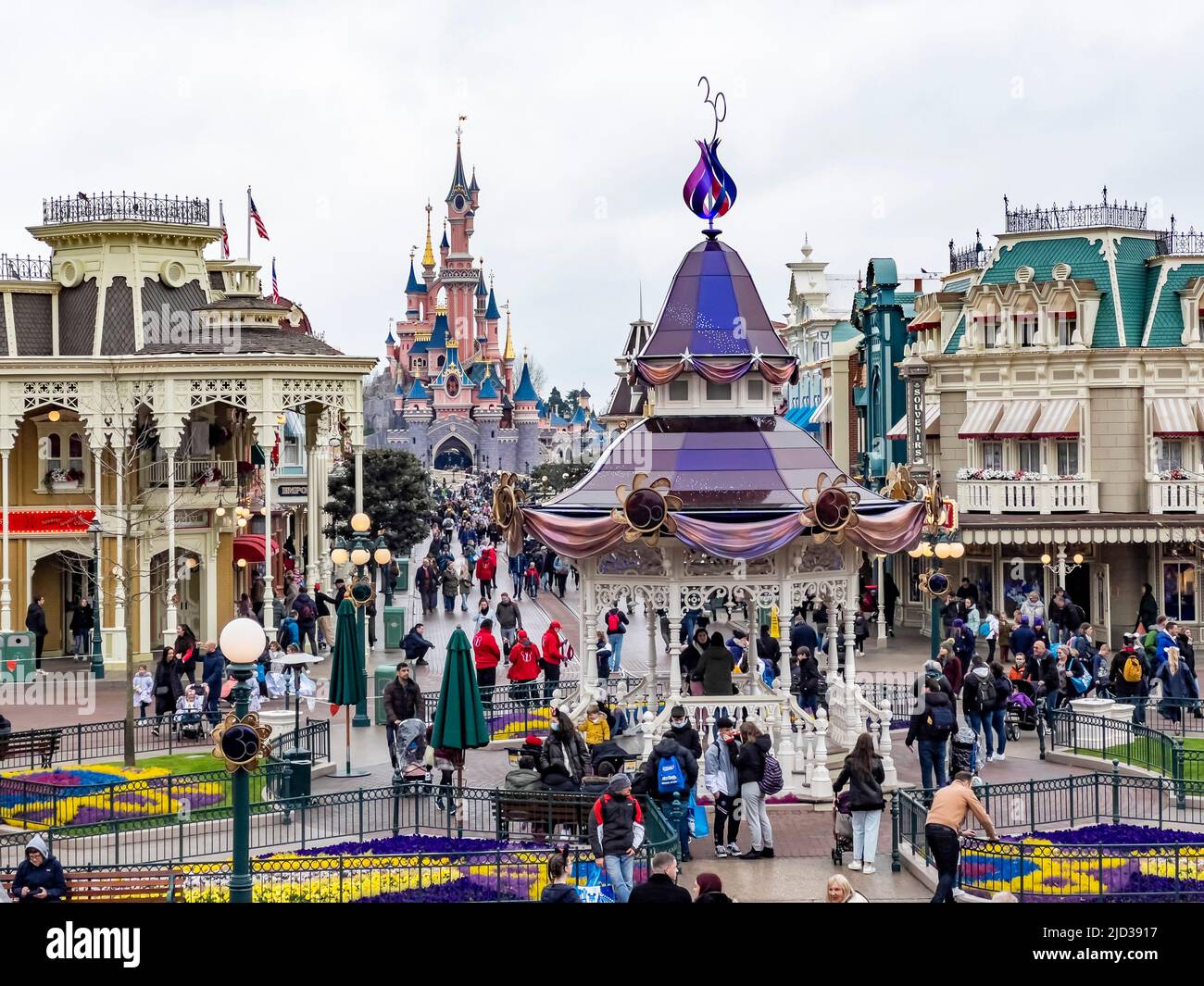 Paris, France - 04/05/2022: Colorful square of Disneyland. People walking around. Stock Photo