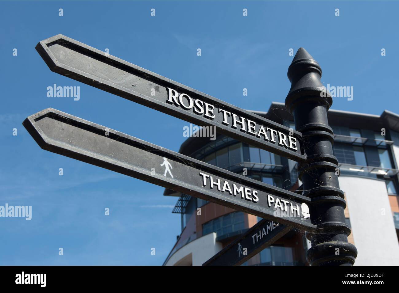 left-pointing wayfinding signs for the rose theatre and the thames path in kingston upon thames, surrey, england Stock Photo