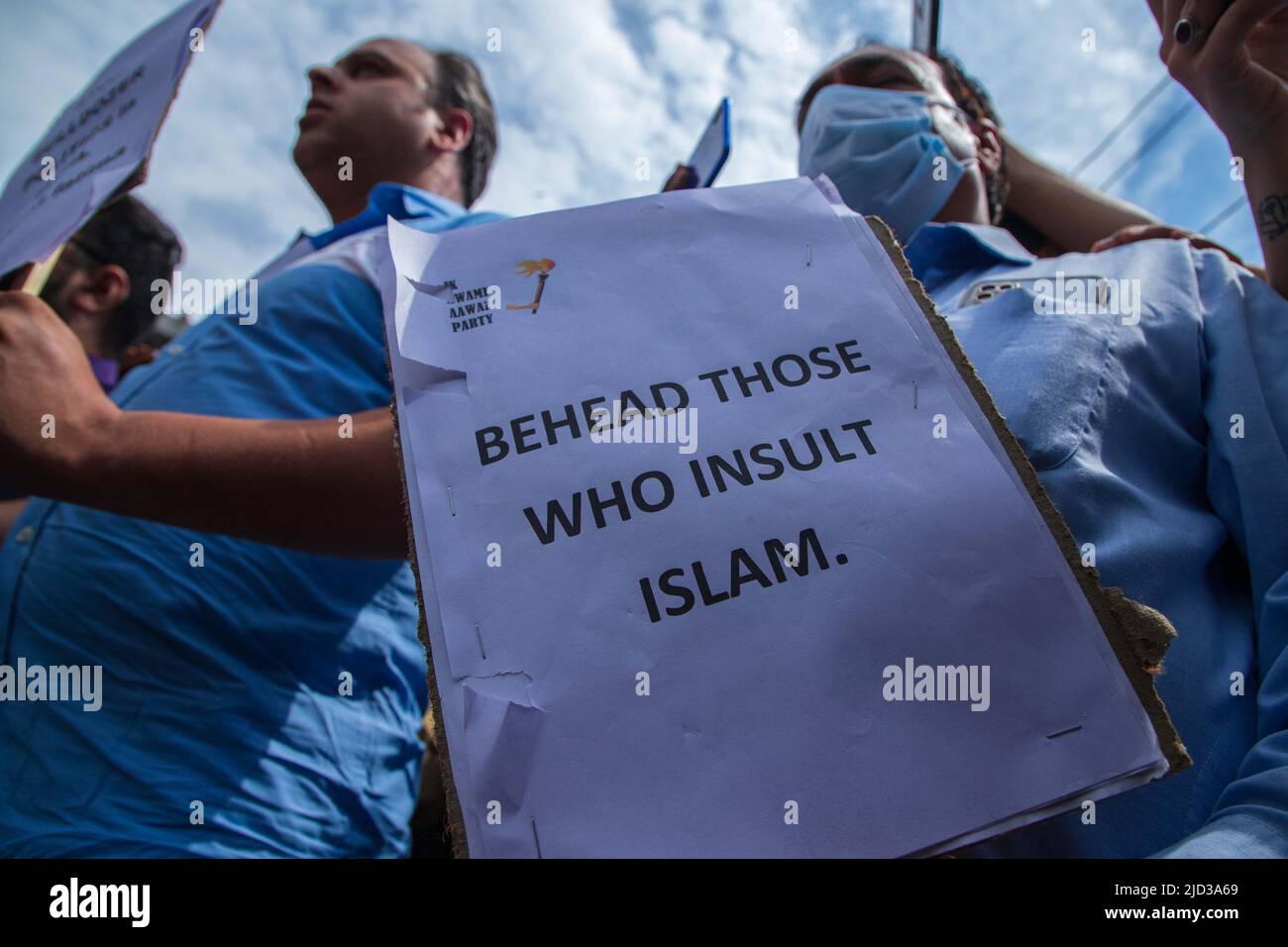 Kashmiri man holds a placard expressing his opinion during a ...