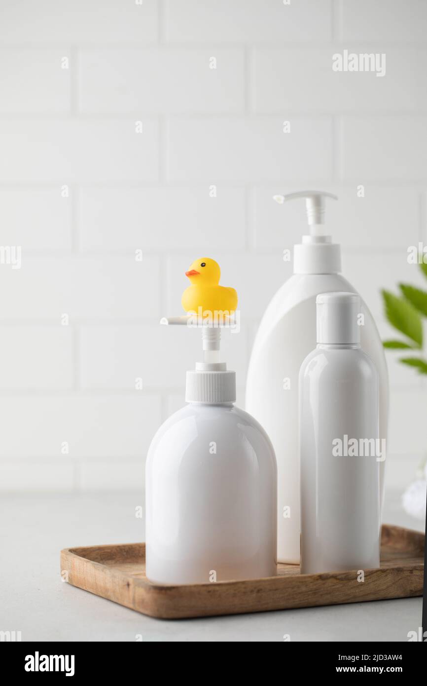 Blank plastic dispenser bottles with soap and shampoo for everyday in