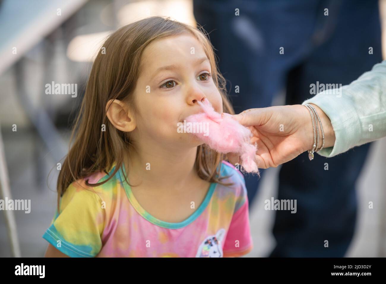 Child eating cotton candy Stock Photo Alamy