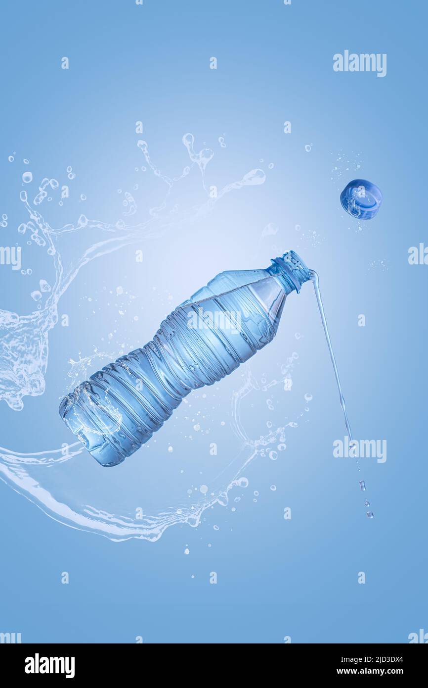 Flying bottle of mineral water with splash on blue background with copyspace and vertical format. Pure water levitation concept. Stock Photo
