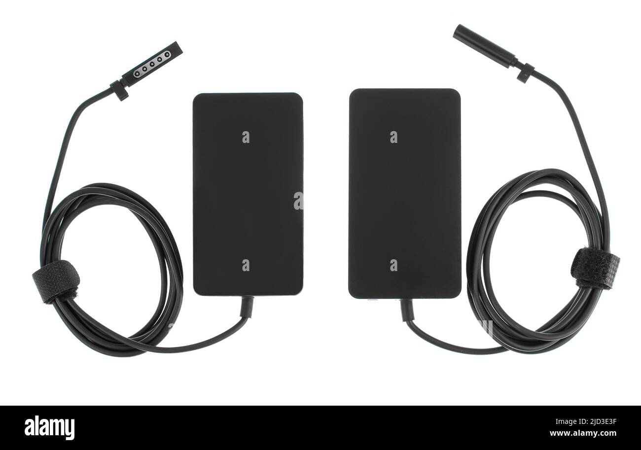laptop power adapter, laptop spare part on white background, top view Stock Photo