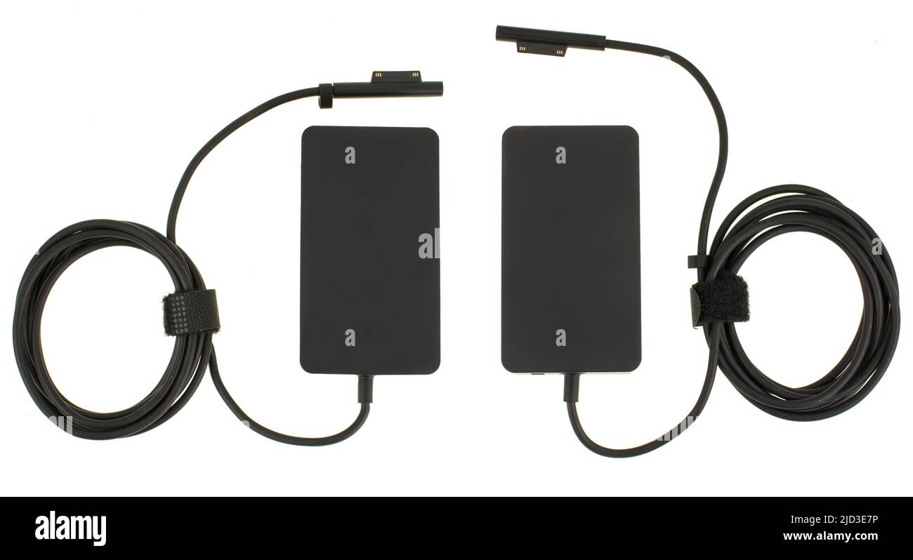 laptop power adapter, laptop spare part on white background, top view Stock Photo