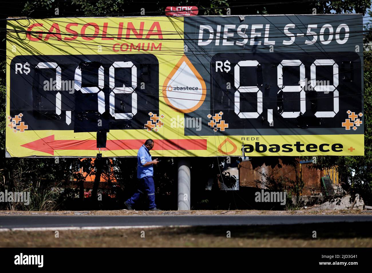 Gasoline and diesel price are displayed near a gas station following the announcement of updated fuel prices at at the Brazilian oil company Petrobras in Brasilia, Brazil June 17, 2022. REUTERS/Ueslei Marcelino Stock Photo