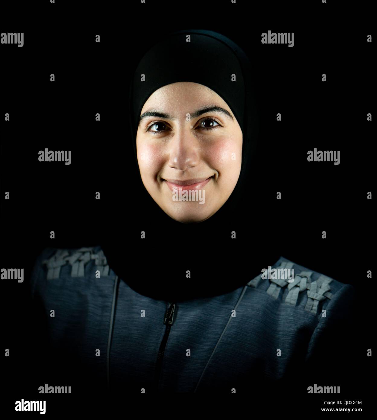 Attractive Muslim woman on black background. High quality photo Stock Photo