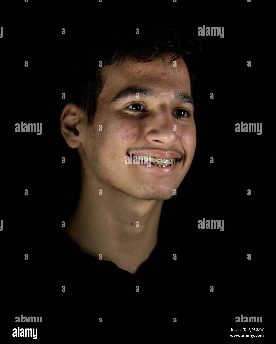 Portrait of real happy mixed race teenager smiling. High quality photo