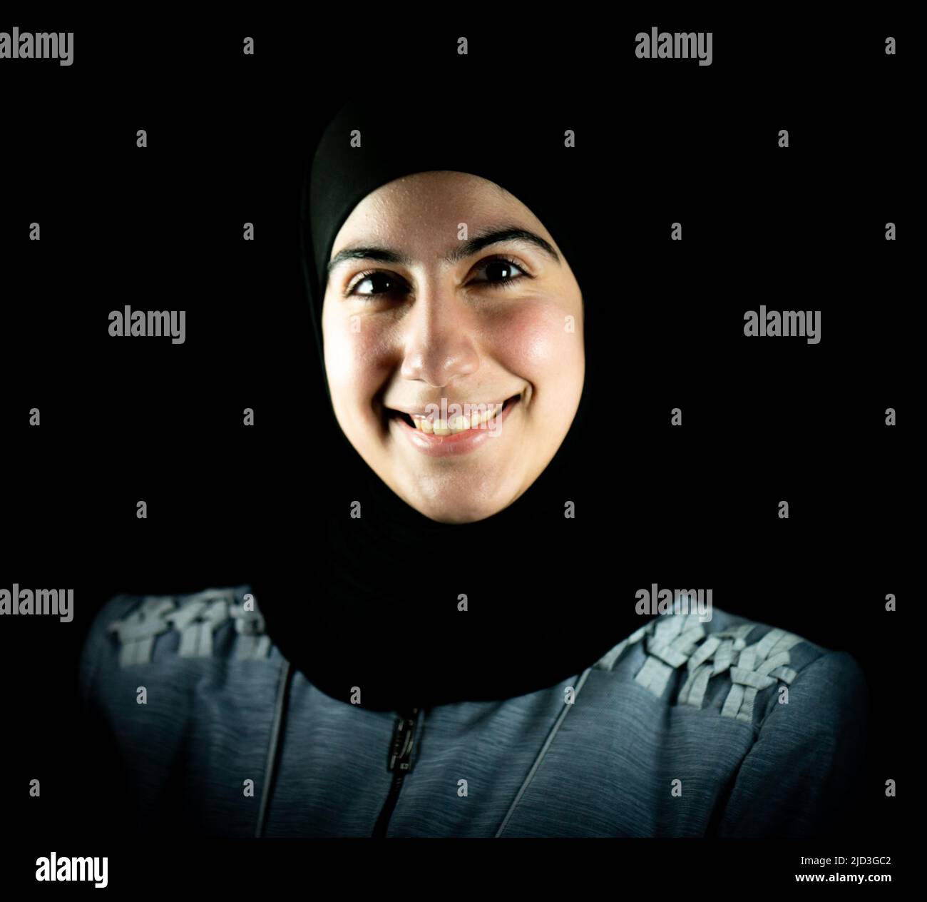 Attractive Muslim woman on black background. High quality photo Stock Photo