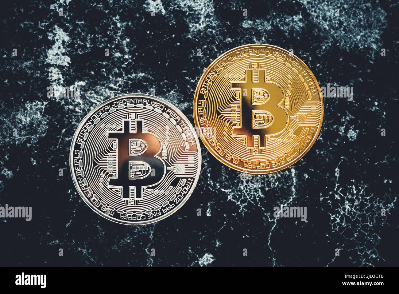 Silver and gold bitcoins on black background. Bitcoin mining concept. A two  shiny coins of cryptocurrency on dark backdrop. Virtual money Stock Photo -  Alamy