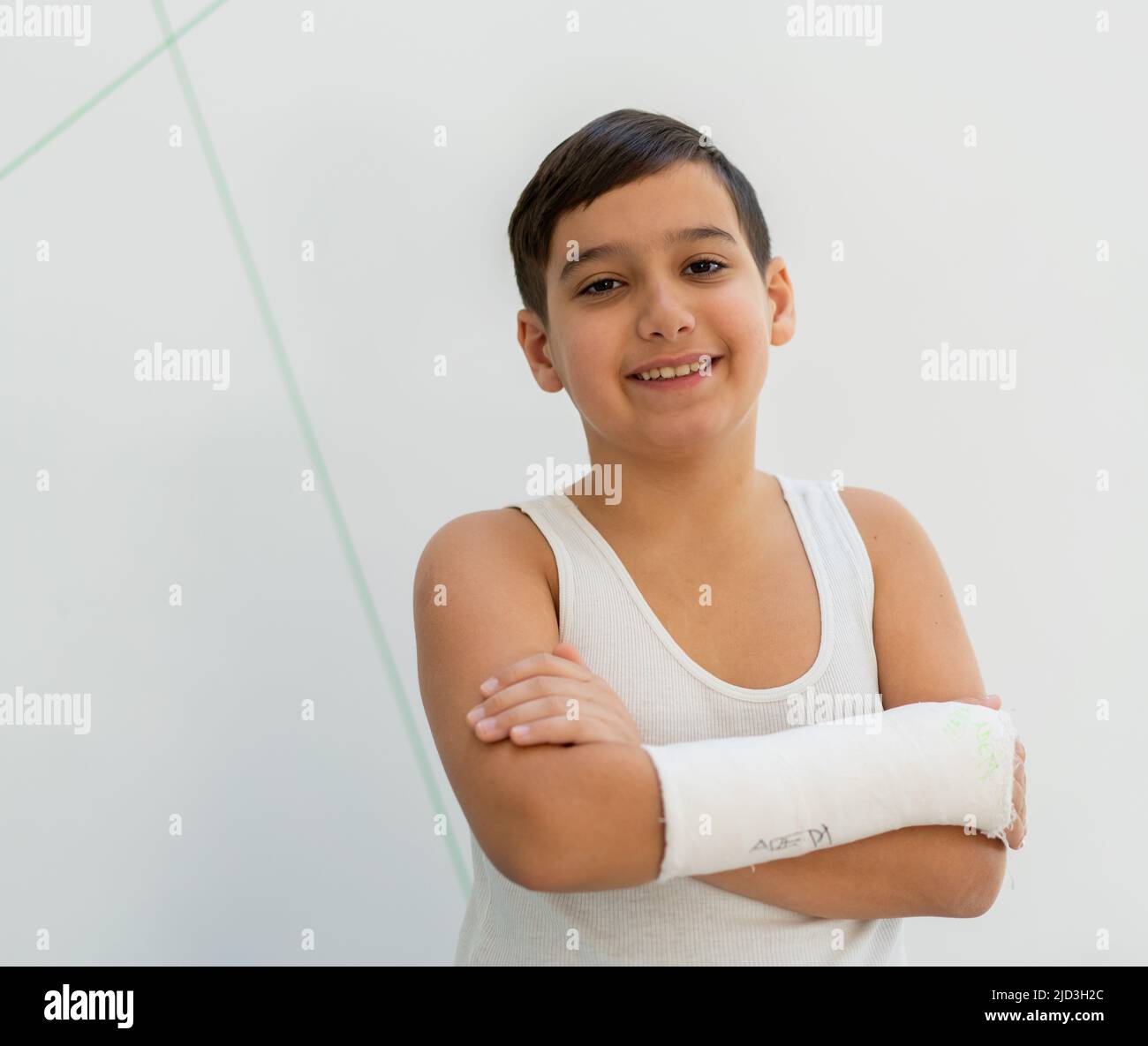 Boy keeps broken arm in gypsum, plaster arm, accident at home , injury, trauma concept. High quality photo Stock Photo