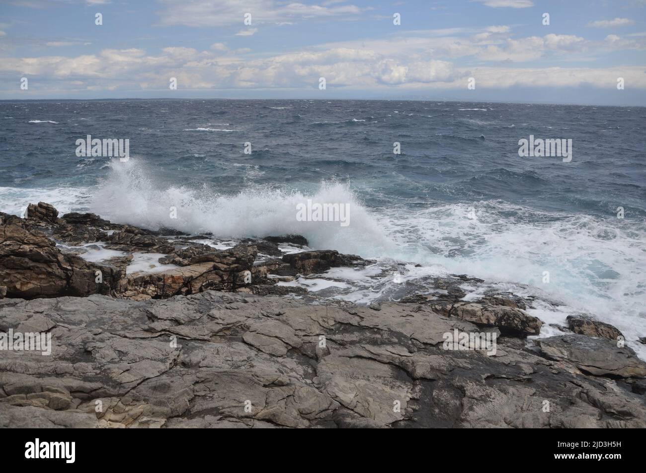 Losinj coastline and rough sea. Stormy weather on the adriatic sea with rough sea in island Losinj Croatia . Stock Photo