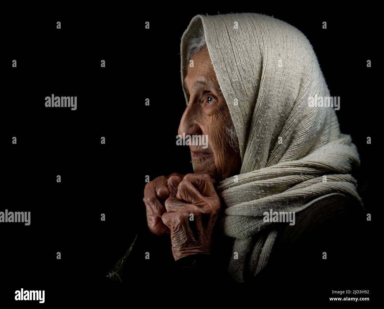 Elderly woman with kerchief, studio portrait. High quality photo Stock Photo