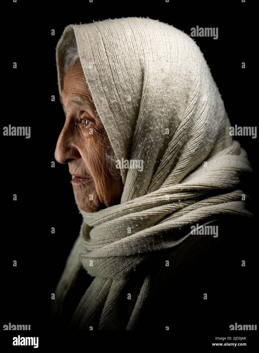 Elderly woman with kerchief, studio portrait. High quality photo Stock Photo