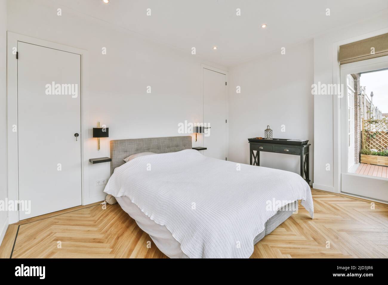 Home interior design of bedroom with bed near window in modern