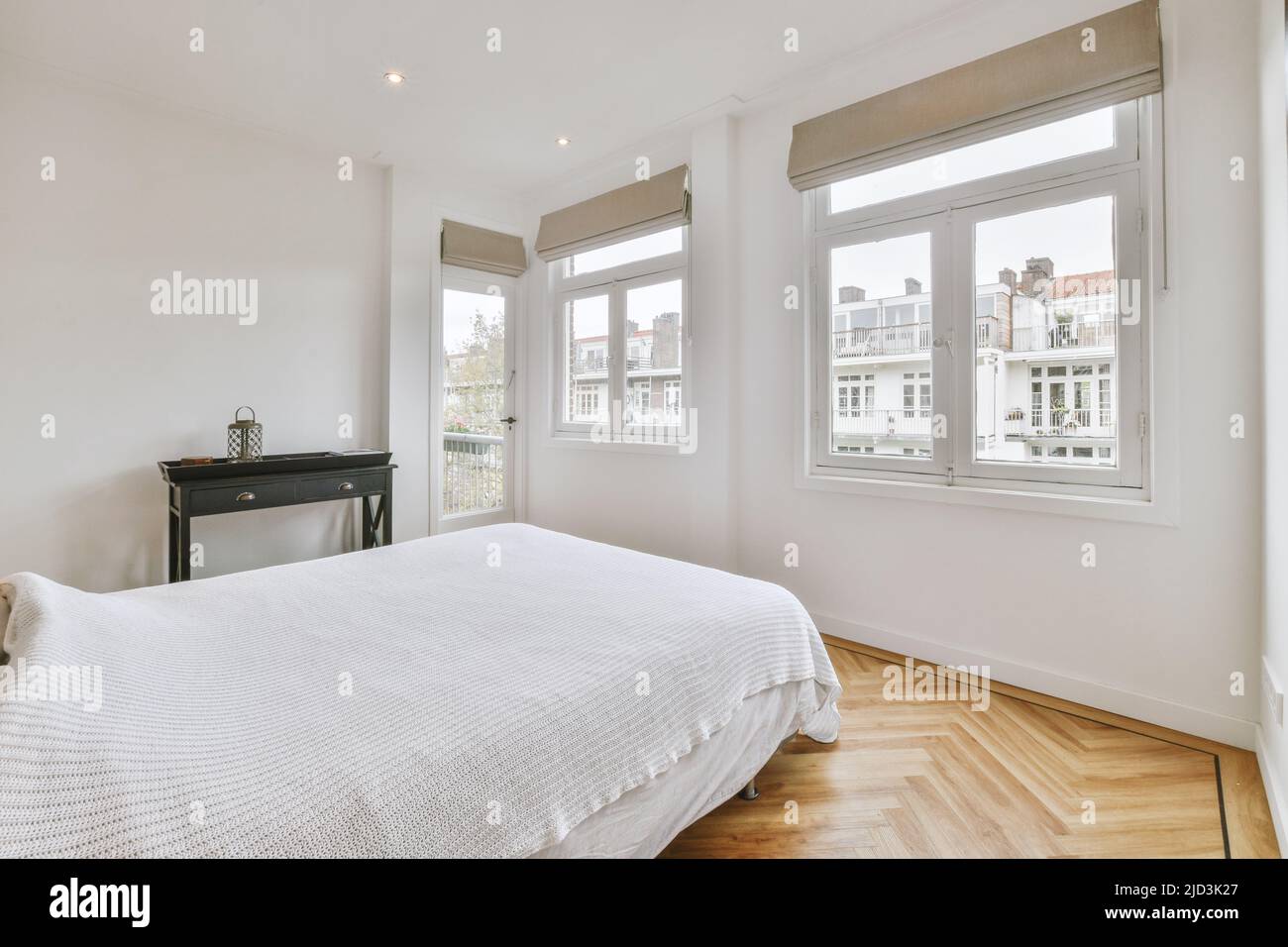 Home interior design of bedroom with bed near window in modern