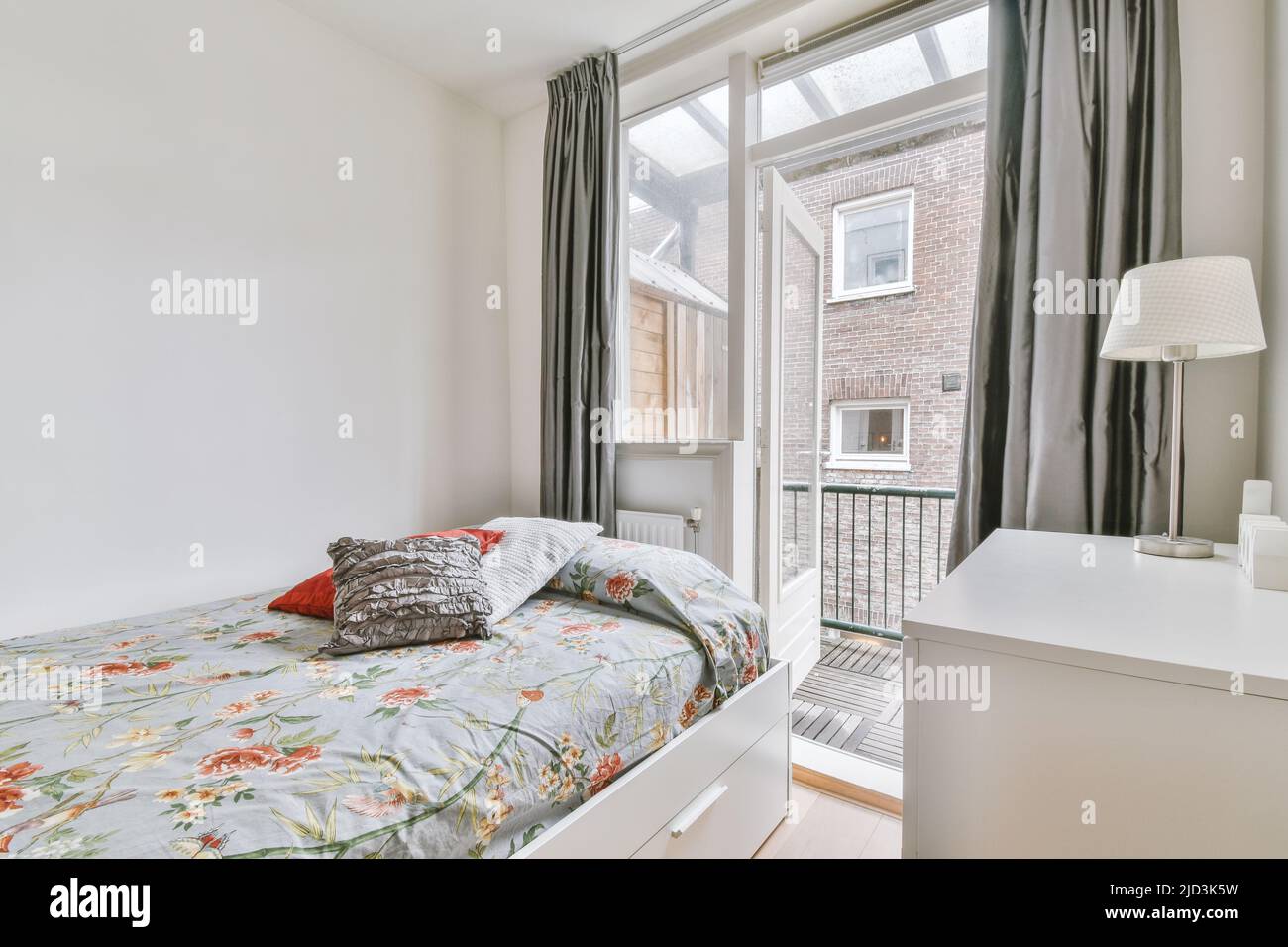 Home interior design of bedroom near window in modern apartment Stock