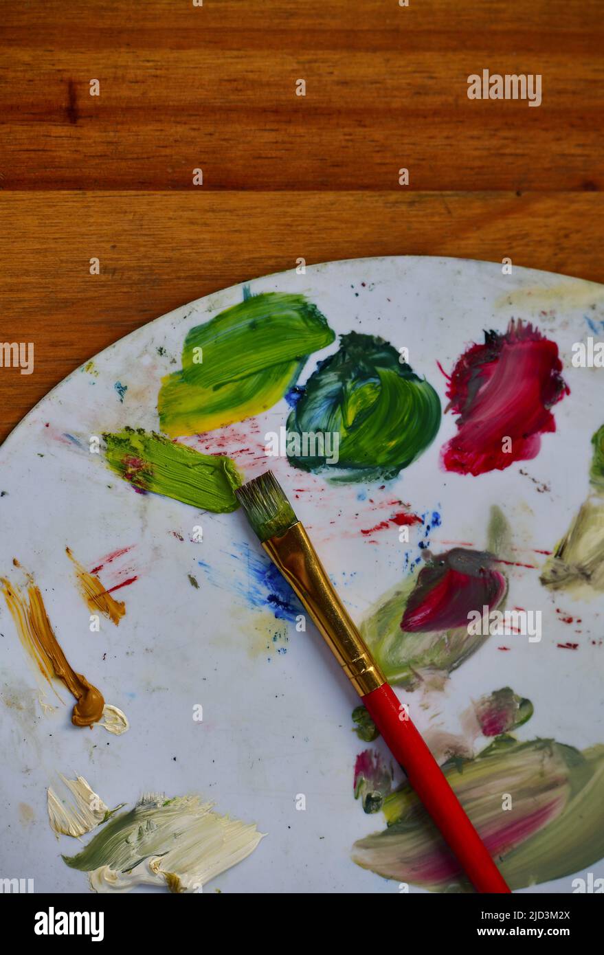 Top view of a painters palette with colors and brush Stock Photo