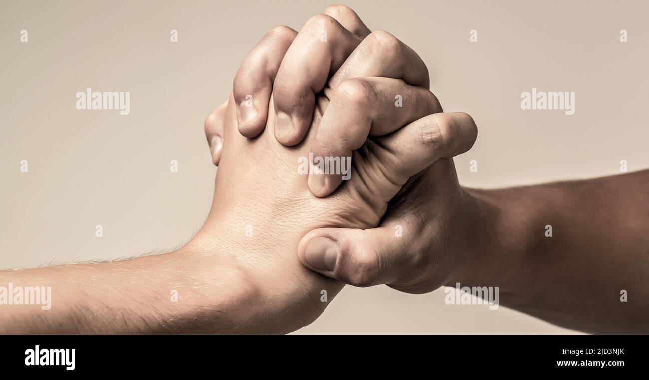 Two hands, isolated arm, helping hand of a friend. Friendly handshake, friends greeting Stock