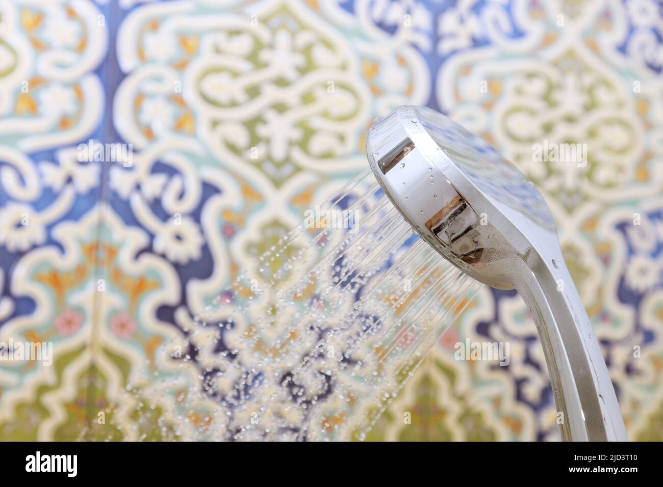 Shower head in bathroom with water drops flowing Stock Photo - Alamy