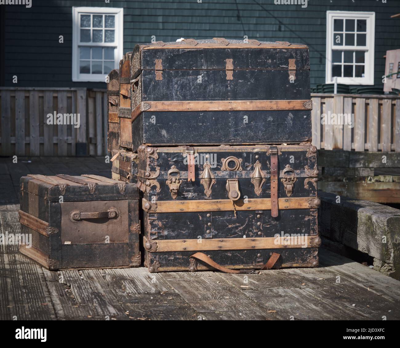 Old vintage travelling trunks on a dockside ready for boarding Stock Photo