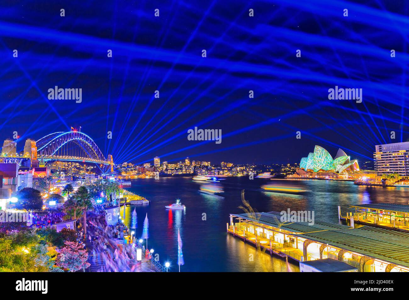 Sydney harbour Circular quay and The Rocks brightly illuminated at Vivid Sydney lights festival at night. Stock Photo