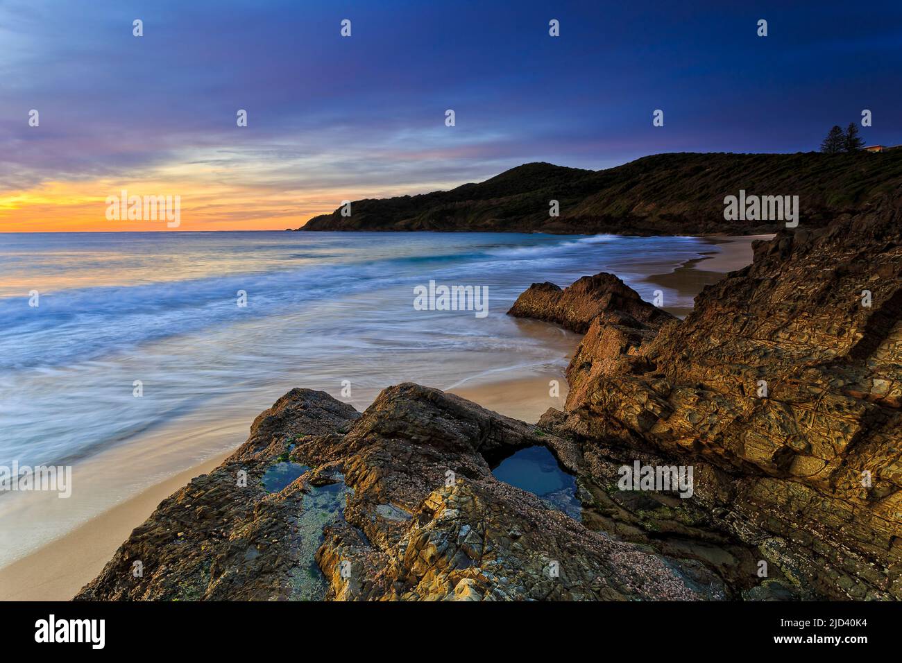 Scenic seascape off Burgess beach in Forster town on Mid North coast of Australian Pacific at sunrise. Stock Photo