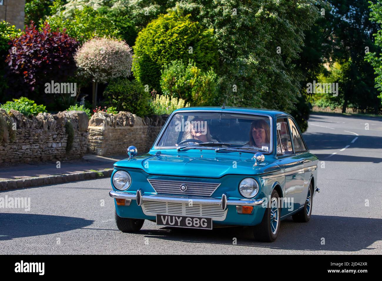 Singer Chamois Rally 1968 Singer Chamois driving through an English village Stock Photo - Alamy